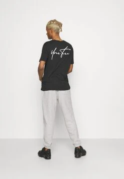 YOURTURN Unisex - Trainingsbroek - Mottled Light Grey -Yourturn 44af697d8af34693a7b3385401313f6d